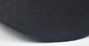 Detailed close-up showing the fine texture and quality of black wool fabric on this cap