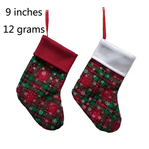 Plaid Christmas stocking set with snowflake patterns and red hanging loops for holiday decor