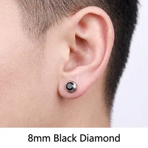Black magnet earring for men, 8mm round stainless steel stud shown on a human ear