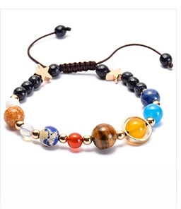 Detailed close-up of solar system natural stone beads on a brown braided cord