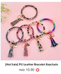 Close-up of PU leather bracelet keyrings with leopard print, snake skin patterns and tassels