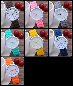 Collage of ultra-thin silicone watches in seven vibrant colors on a wooden table