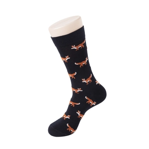 Detailed view of black mid-calf socks with orange fox patterns and ribbed elastic cuffs
