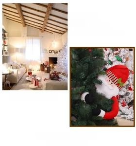 Close-up of plush Santa Claus tree topper decoration with striped hat and green leaf detail