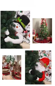 Detail of Santa Claus and snowman plush toppers on a Christmas tree for festive decor