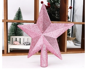Close-up of a pink glitter star tree topper with a hollow base for Christmas tree decoration