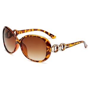 Tortoiseshell oversized sunglasses with brown gradient lenses and metal chain detail