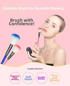 Detail view of makeup brush with gradient bristles and transparent crystal diamond handle