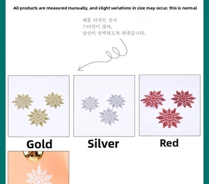 Glittering Christmas snowflake ornaments in gold, silver, and red plastic for tree decor