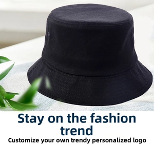 Detail of a black cotton bucket hat with flat top design and reinforced stitching brim