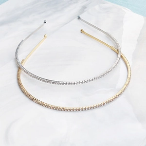 Detail of silver and gold thin bridal headbands with sparkling inlaid rhinestones