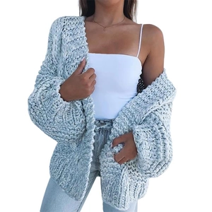 Detailed view of the thick knit texture and light blue mohair fabric on this warm cardigan