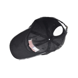 Detail of cotton ponytail baseball cap featuring a rear opening and adjustable metal buckle