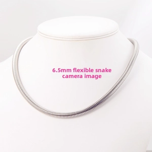 Macro detail of 6.5mm round snake bone chain necklace in silver stainless steel