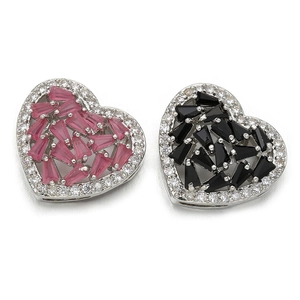 Detailed view of heart-shaped connectors with pink and black cubic zirconia stones