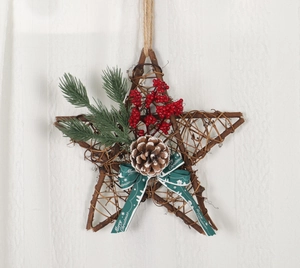 Close-up of wooden star wreath with white roses and Merry Christmas ribbon decoration