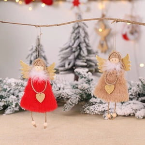 Christmas plush angel ornaments with golden wings and hearts on a festive snowy branch
