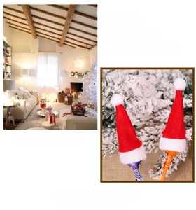 Mini red and white plush Christmas lollipop hats for festive candy and cutlery decoration