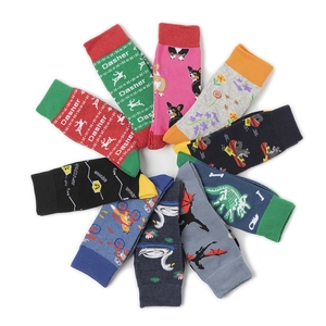 Flat lay of colorful mid-calf cotton socks with diverse cartoon patterns and animal prints