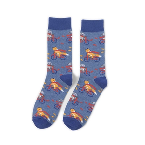 Detailed view of blue knitted crew socks with cute fox and panda riding a bike pattern
