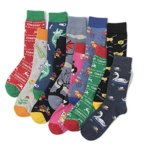Flat lay of colorful crew socks with diverse knit patterns and animal motifs