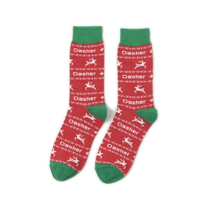 Detail of knit Christmas socks with red-green colors and reindeer patterns featuring Dasher