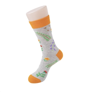 Detail of floral cotton crew socks with gray base and orange contrasting toe and heel