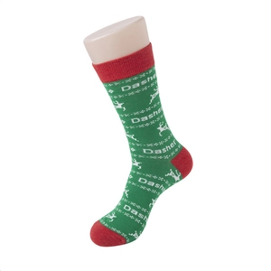 Detailed knit of Christmas socks with reindeer pattern and festive green and red contrast