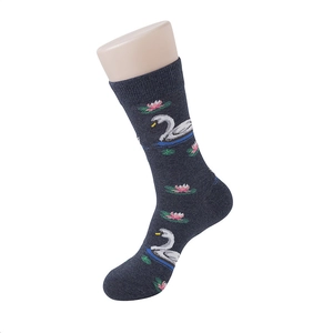 Detailed close-up of dark grey cotton mid-tube socks featuring swan and lotus patterns