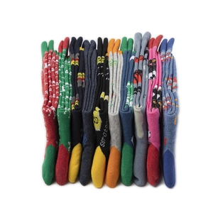 Close-up of colorful mid-calf cotton socks with various patterns and serotonin text design