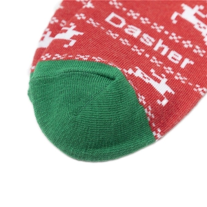 Close-up of Christmas knit socks featuring reindeer pattern and Dasher text detail