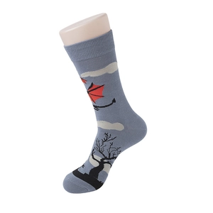 Detail view of grey cotton crew socks featuring knitted moon and dragon wings pattern