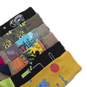 Detail view of colorful cotton crew socks featuring graffiti prints and athletic patterns