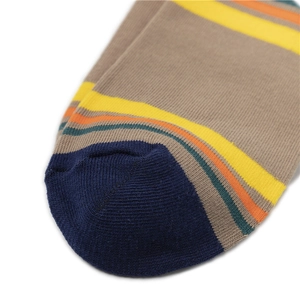 Macro shot of fine knit toe seams on colorful striped cotton crew socks for men