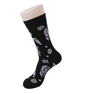 Detailed texture of black cotton crew socks with purple and green pixel game patterns