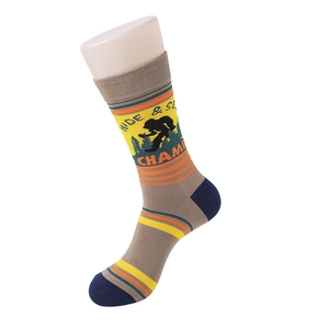 Detail of grey cotton socks with stripes and Bigfoot embroidery on plastic leg model