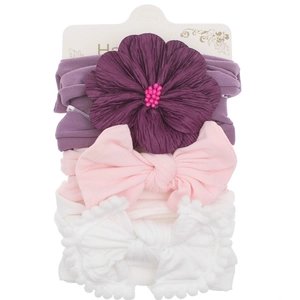 Set of 3 high-elastic baby nylon headbands with purple flowers and pink bows on a card