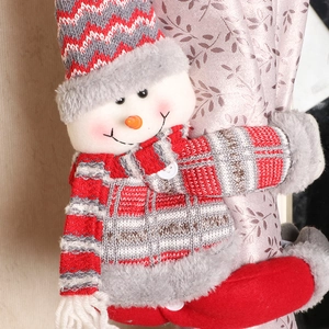 Knitted snowman Christmas curtain tieback with red hat and cozy holiday home decor
