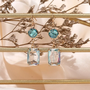 Long geometric crystal drop earrings with blue round stones and iridescent glass pendants