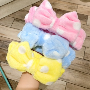 Soft plush bow wash headband with polka dots in pink blue and yellow colors