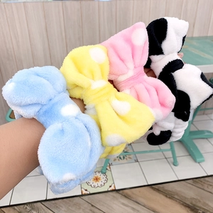 Thick plush coral fleece headband with polka dot bow in blue yellow and pink