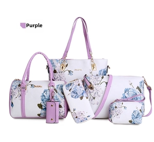 Detail of a 6-piece purple floral handbag set including tote bag and matching wallet