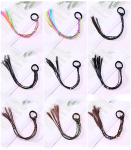 Close-up of nine colorful hair tie styles with braids, beads, and heart charms details