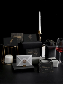 Detail of elegant black and gold greeting cards with diverse English foil greetings