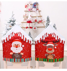 Close-up of Santa and reindeer Christmas chair covers with Warm Wishes text design
