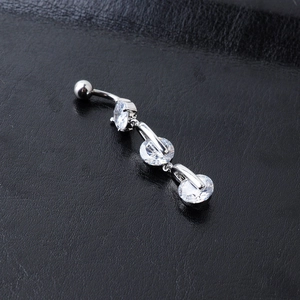 Silver belly button ring with three gradient clear cubic zirconia stones on black leather