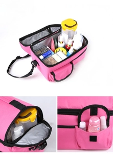 Detail of pink insulated bag with open zipper showing layered interior storage