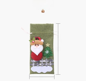 Size display of a green burlap Christmas drawstring wine bag with 3D Santa and tree