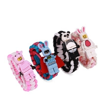 Close-up of colorful handmade braided bracelets featuring various cartoon animal charms