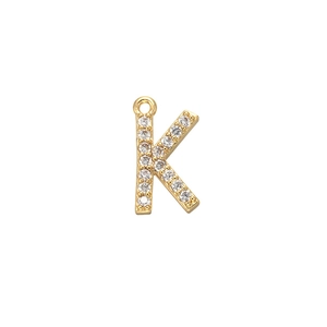 Detail of gold letter K pendant with micro-pave cubic zirconia crystals and top bail